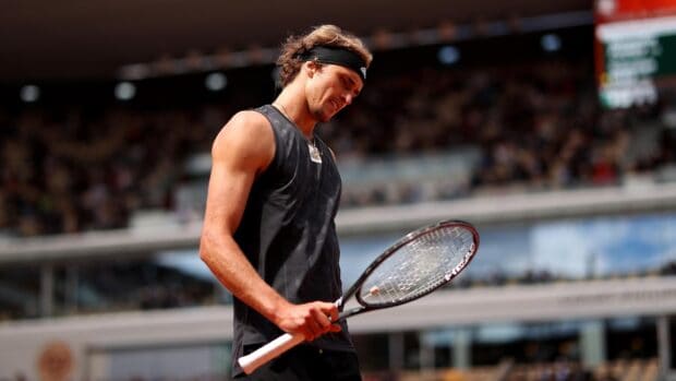 A tennis player holding a racket on the court during the French Open Roland Garros match, 2K Desktop Wallpaper