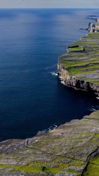 The Aran Islands show rugged coastal cliffs with deep blue ocean waters, HD Mobile Wallpaper