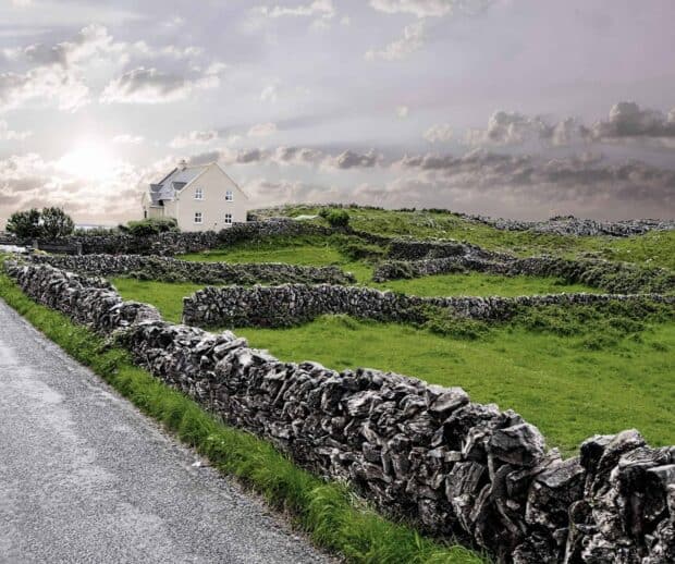 The Aran Islands feature stone walls dividing lush green fields under a cloudy sky, HD Desktop Wallpaper