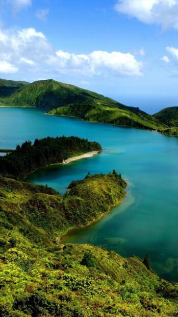 The Azores showcases a stunning green landscape surrounding calm blue water, HD Phone Wallpaper