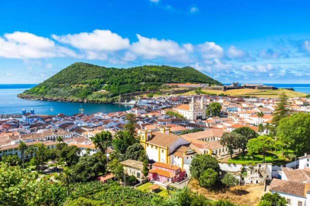 The Azores feature a coastal town with lush greenery and clear blue skies, HD Desktop Wallpaper