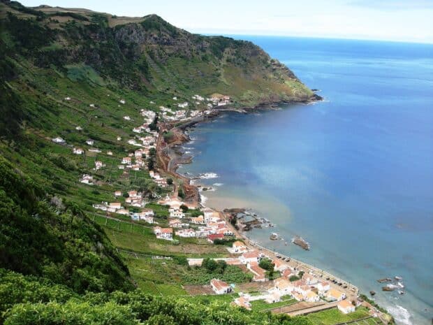 The Azores showcases a picturesque coastal village surrounded by green hills and the ocean, HD Desktop Wallpaper