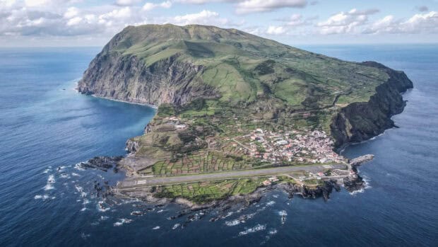 The Azores island displays a coastal landscape with fields and cliffs surrounded by the ocean, 2K Desktop Wallpaper