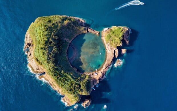 The Azores feature a lush island surrounded by deep blue ocean waters, HD Desktop Wallpaper