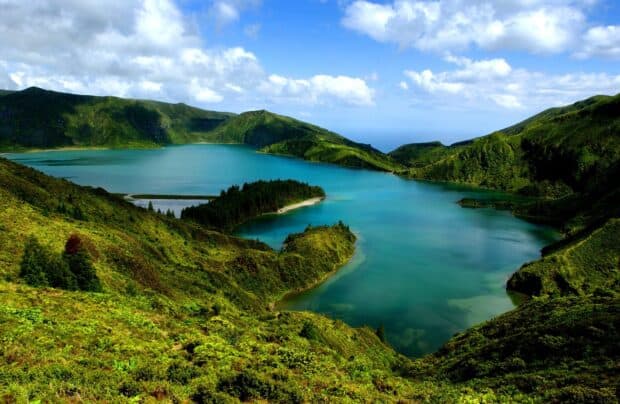 The Azores features a stunning lake surrounded by lush green hills under a blue sky, HD Desktop Wallpaper