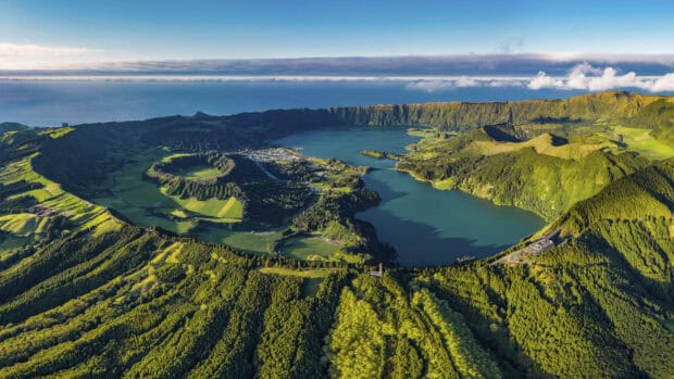 The Azores feature lush green forests and volcanic lakes under a clear blue sky, HD Desktop Wallpaper