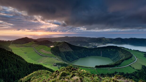 The Azores features a volcanic crater lake surrounded by lush greenery at sunset, HD Desktop Wallpaper