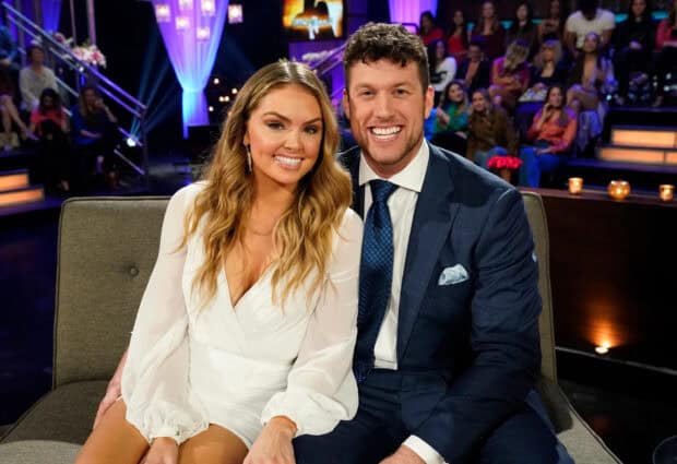 A couple from The Bachelor TV series smiling together on a couch during the show, 2K Desktop Wallpaper