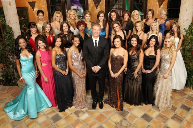The Bachelor Tv Series features a man surrounded by women in elegant dresses at a formal event, HD Desktop Wallpaper