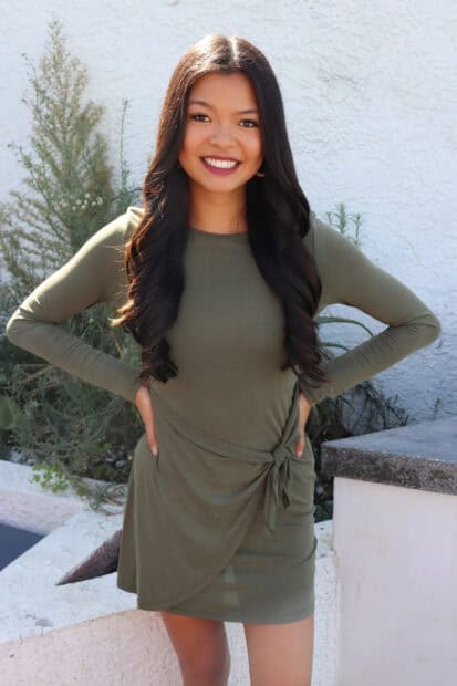 A smiling woman from The Bachelor Tv Series stands outdoors wearing a green dress, HD Mobile Wallpaper