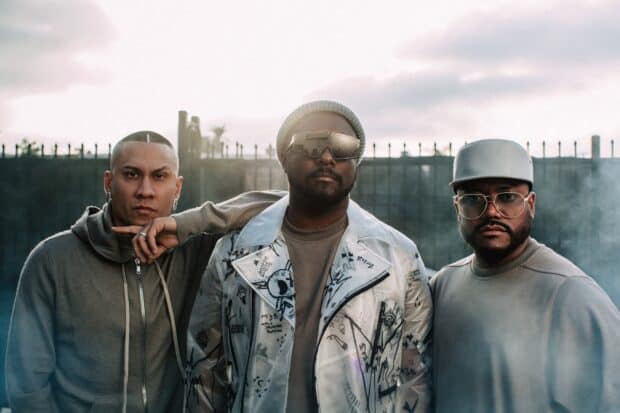 The Black Eyed Peas stand together posing outdoors at sunset, HD Desktop Wallpaper