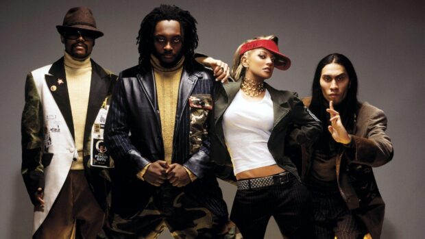 The Black Eyed Peas pose together wearing eclectic fashion styles in a studio setting, HD Desktop Wallpaper