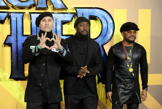 The Black Eyed Peas group posing together in black outfits at an event, 2K Desktop Wallpaper