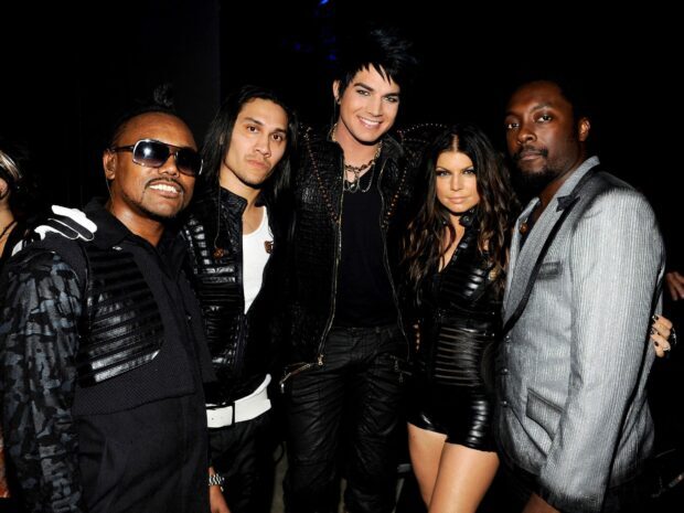 The Black Eyed Peas group posing together in stylish outfits at an event, HD Desktop Wallpaper