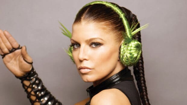 A close up of a Black Eyed Peas member wearing unique green braided accessories, HD Desktop Wallpaper