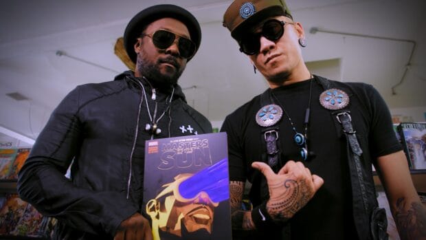 Two members of The Black Eyed Peas pose with Masters of the Sun album in a comic store, 4K Desktop Wallpaper