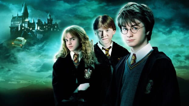 The Chamber Of Secrets features main characters in front of a magical castle, 4K Desktop Wallpaper