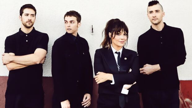The Interrupters stand together in front of a textured wall, HD Desktop Wallpaper