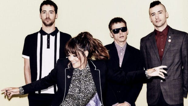 The Interrupters band members stand and smile for a group photo, HD Desktop Wallpaper
