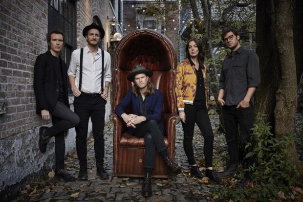 The Lumineers Wallpapers featuring five members posing outdoors near a large chair, HD Desktop Wallpaper