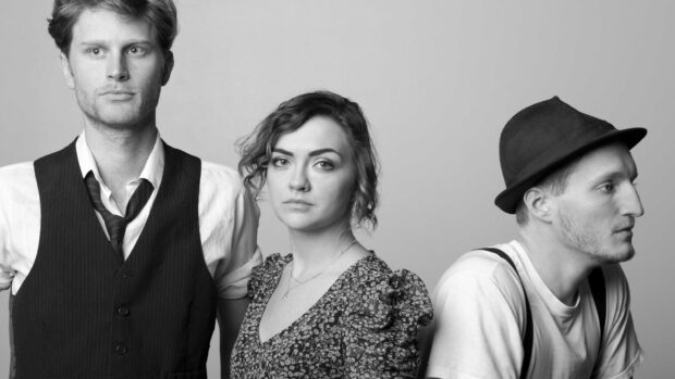 The Lumineers pose in a black and white photo with serious expressions, HD Desktop Wallpaper