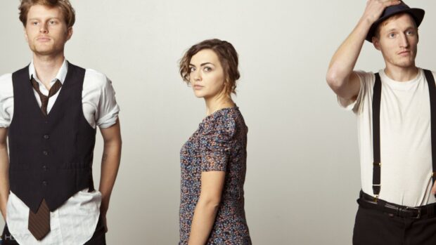 The Lumineers stand in a neutral setting with serious expressions and vintage inspired clothing, HD Desktop Wallpaper