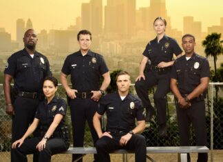 The Rookie Tv Series cast posing in front of a cityscape with police uniforms, 2K Desktop Wallpaper
