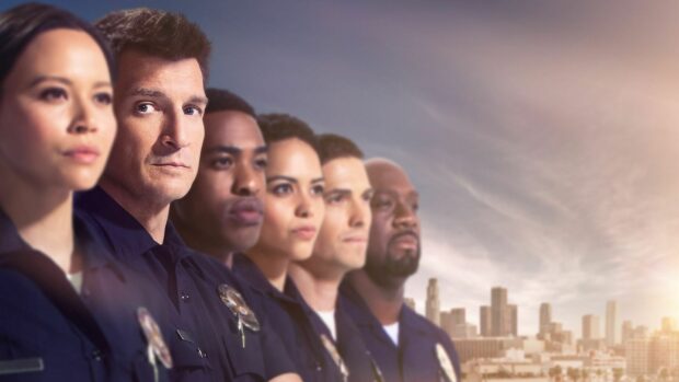 The Rookie TV series cast stands together with a city skyline in the background, HD Desktop Wallpaper