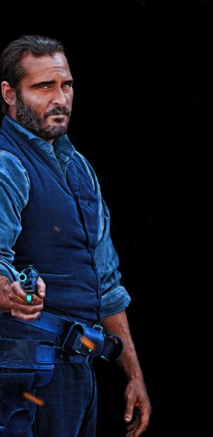 A tough character from The Sisters Brothers holds a handgun while wearing a blue vest, 2K Phone Wallpaper