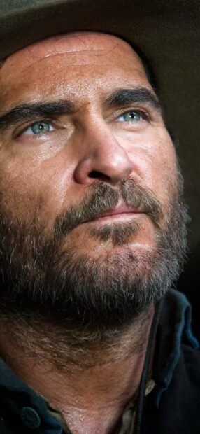 A close up portrait of a man with blue eyes and a beard from The Sisters Brothers, HD Phone Wallpaper