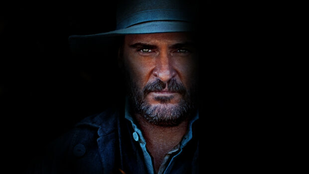The Sisters Brothers features a close up portrait of a serious man with a beard and hat, 2K Desktop Wallpaper