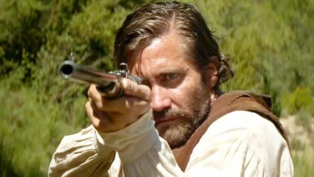 A man aims a rifle intently in The Sisters Brothers setting, HD Desktop Wallpaper