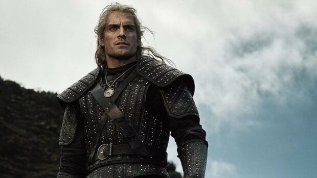 The Witcher Tv Series wallpapers feature a character in detailed armor standing outdoors under a cloudy sky, HD Desktop Wallpaper
