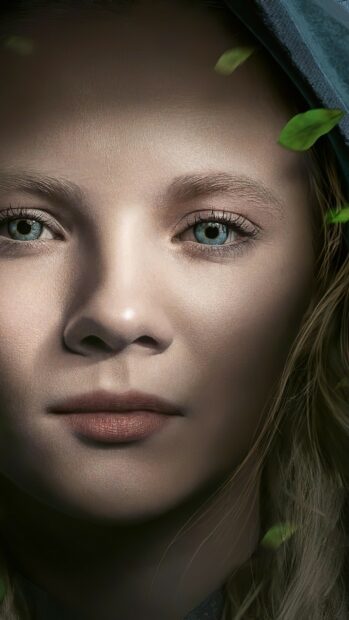 A close up of a woman from The Witcher tv series with blue eyes and green leaves, 2K Phone Wallpaper