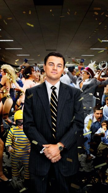 A confident man stands in a chaotic party scene from The Wolf of Wall Street, 2K Mobile Wallpaper