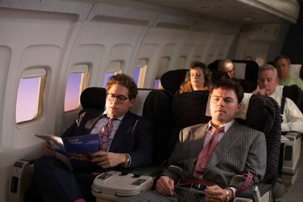 Jordan Belfort and Donnie Azoff are seated on a plane, HD Desktop Wallpaper