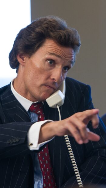 A man in a pinstripe suit makes an intense phone call while pointing, HD Phone Wallpaper