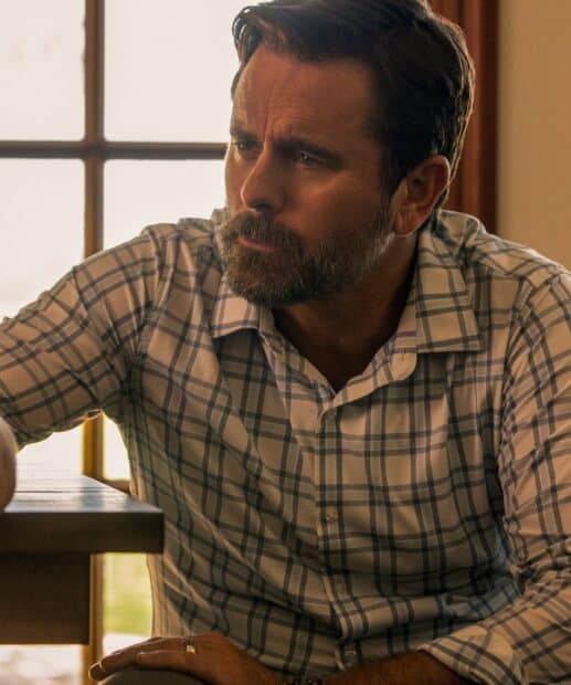 A man in a plaid shirt is thoughtfully sitting near a window in Nashville Tv Series, HD Phone Wallpaper