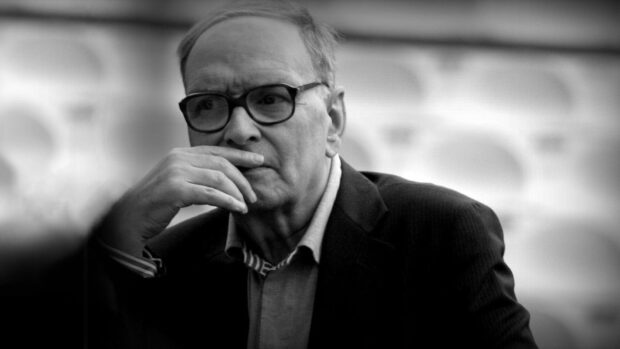 A pensive man deep in thought is captured in this Ennio Morricone wallpaper, HD Desktop Wallpaper