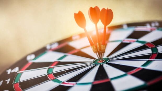 Three darts hitting the bullseye on a dartboard in perfect alignment, HD Desktop Wallpaper