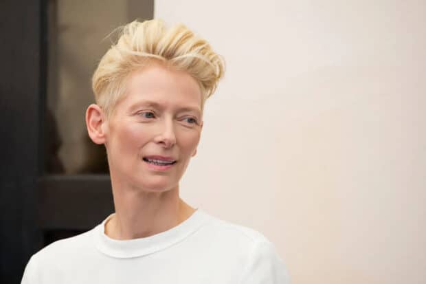 Tilda Swinton looks away thoughtfully in a white shirt, HD Desktop Wallpaper