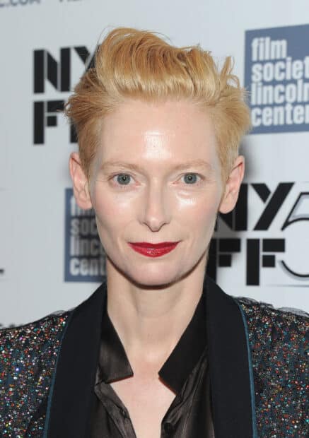 Tilda Swinton smiles wearing red lipstick and a glittery outfit, HD Desktop Wallpaper
