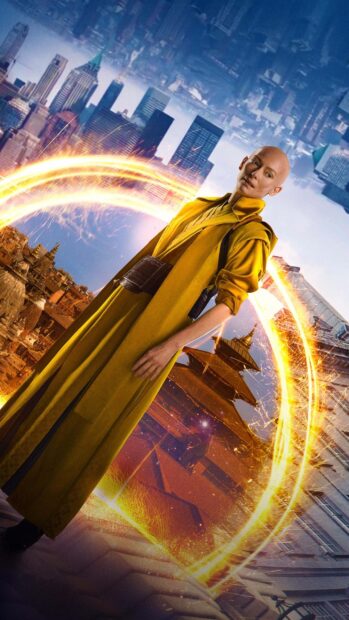 Tilda Swinton stands in a glowing magical portal with city buildings and temples in the background, 2K Phone Wallpaper