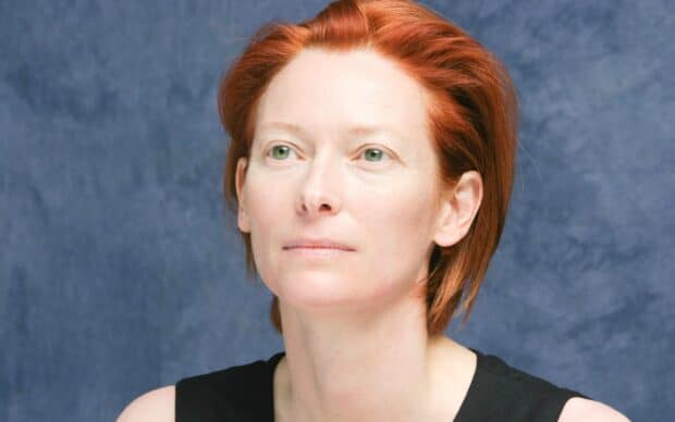 A close up of Tilda Swinton with red hair and green eyes, HD Desktop Wallpaper