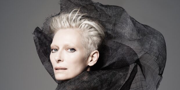 Tilda Swinton displays a dramatic look with short white hair and flowing black fabric, HD Desktop Wallpaper