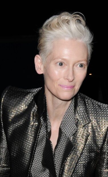 Tilda Swinton is wearing a metallic patterned jacket with a black and white shirt, 2K Phone Wallpaper