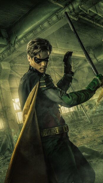 A hero from Titans Tv Series is ready for battle with his staff in a ruined building, HD Phone Wallpaper