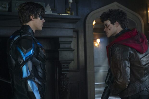 The Titans tv series features a tense confrontation between two characters in a dimly lit room, HD Desktop Wallpaper