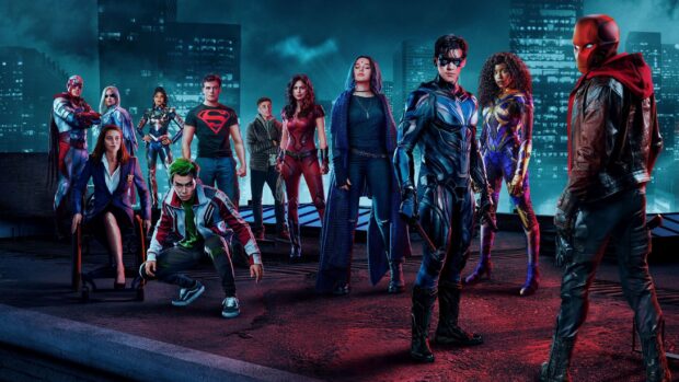 The Titans TV series main characters stand together on a rooftop at night in the city, 2K Desktop Wallpaper