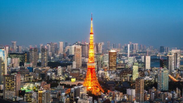 The Tokyo Tower lights up the cityscape during the evening in Tokyo, 4K Desktop Wallpaper